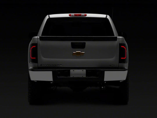 Raxiom 07-14 Chevrolet Silverado 1500 Axial Series LED Tail Lights- Blk Housing (Smoked Lens)