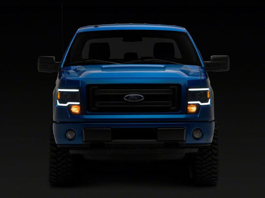 Raxiom 09-14 Ford F-150 Axial Series Projector Headlights w/ LED Light Bar- Blk Housing (Clear Lens)