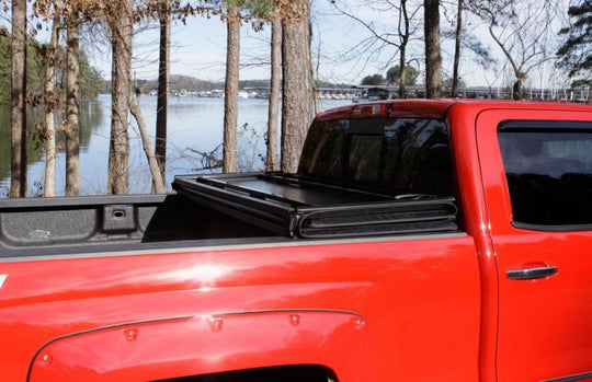 Lund 09-17 Dodge Ram 1500 Fleetside (5.7ft. Bed) Hard Fold Tonneau Cover - Black