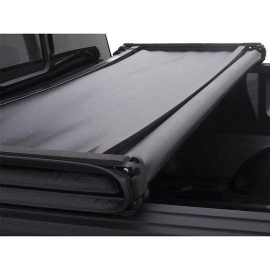 Lund 19-23 Chevrolet Silverado 1500 (5.5ft. Bed) Genesis Tri-Fold Tonneau Cover - Black