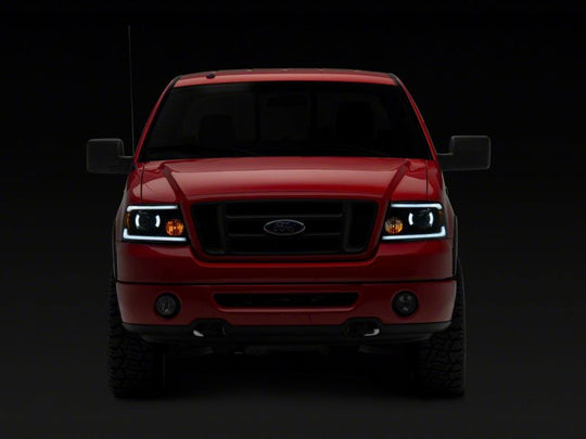 Raxiom 04-08 Ford F-150 Axial Series Projector Headlights w/ SEQL LED Bar- Blk Housing (Clear Lens)