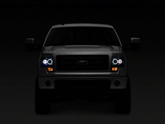 Raxiom 09-14 Ford F-150 Super White LED Halo Projector Headlights- Blk Housing (Clear Lens)