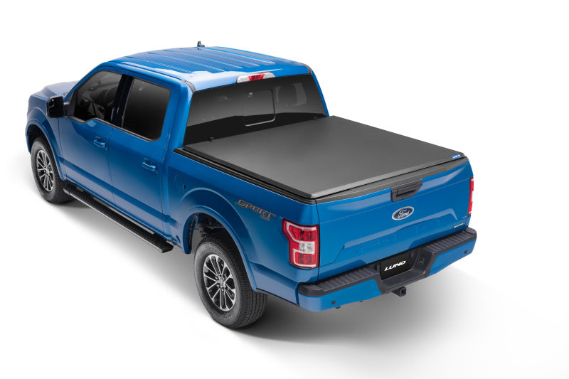 Lund 05-10 Dodge Dakota Fleetside (5.3ft. Bed) Hard Fold Tonneau Cover - Black