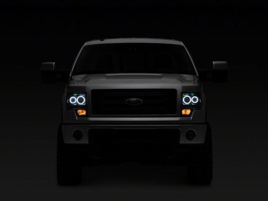 Raxiom 09-14 Ford F-150 Super White LED Halo Projector Headlights- Blk Housing (Clear Lens)