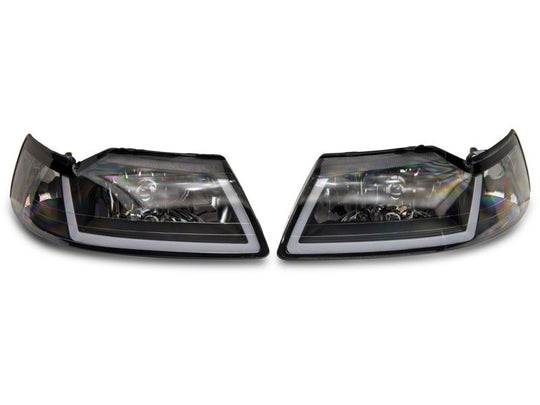 Raxiom 99-04 Ford Mustang Axial Series Headlights w/ Sequential LED Bar- Blk Housing (Clear Lens)