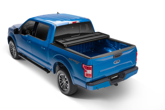 Lund 02-17 Dodge Ram 1500 Fleetside (6.4ft. Bed) Hard Fold Tonneau Cover - Black