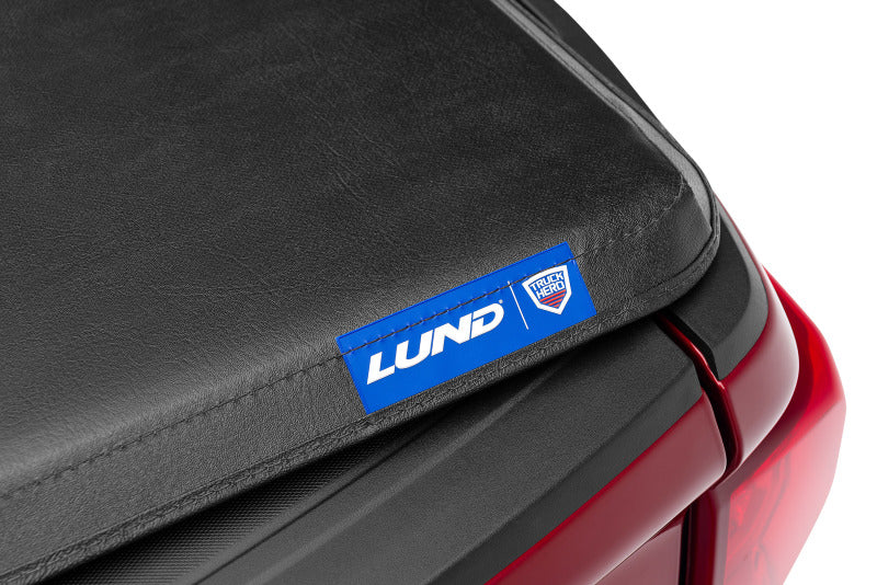 Lund 04-15 Nissan Titan (6.7ft. Bed) Hard Fold Tonneau Cover - Black