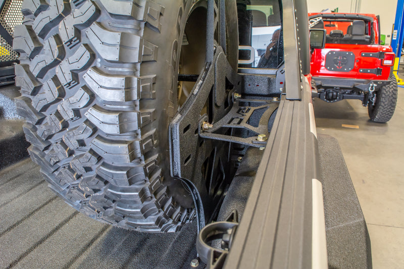 DV8 Offroad 2019+ Jeep Gladiator Universal Stand Up In-Bed Tire Carrier