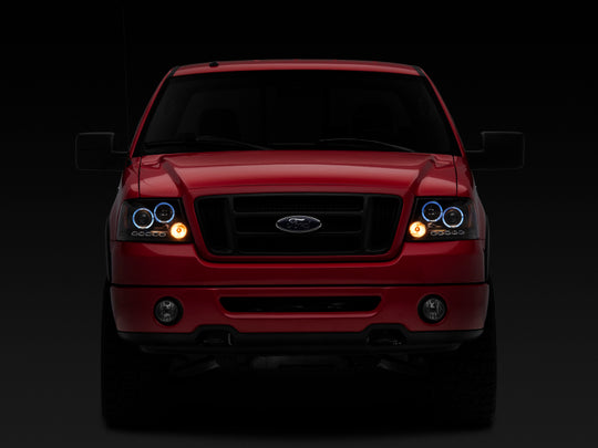 Raxiom 04-08 Ford F-150 Dual LED Halo Projector Headlights- Black Housing (Clear Lens)